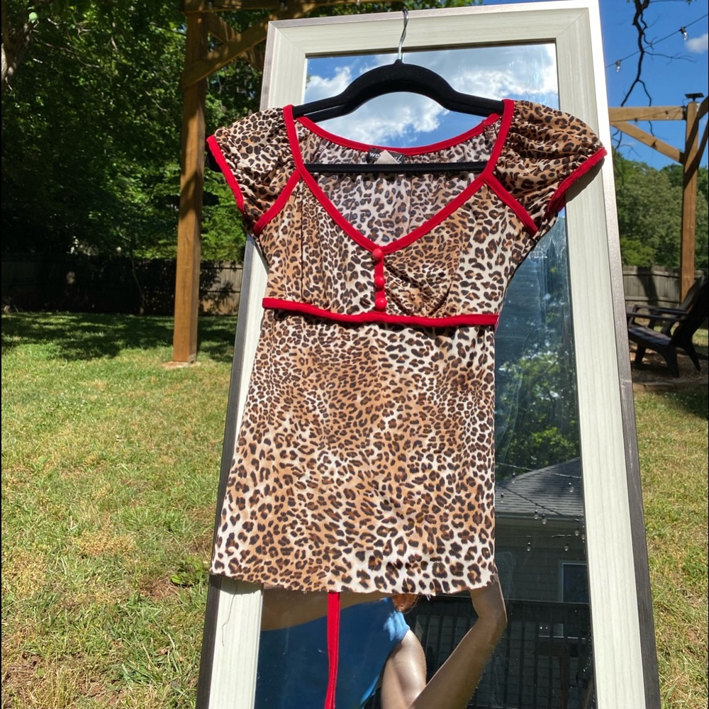 Vintage red lining with cheetah print top.